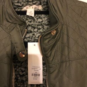 Women’s small green vest.